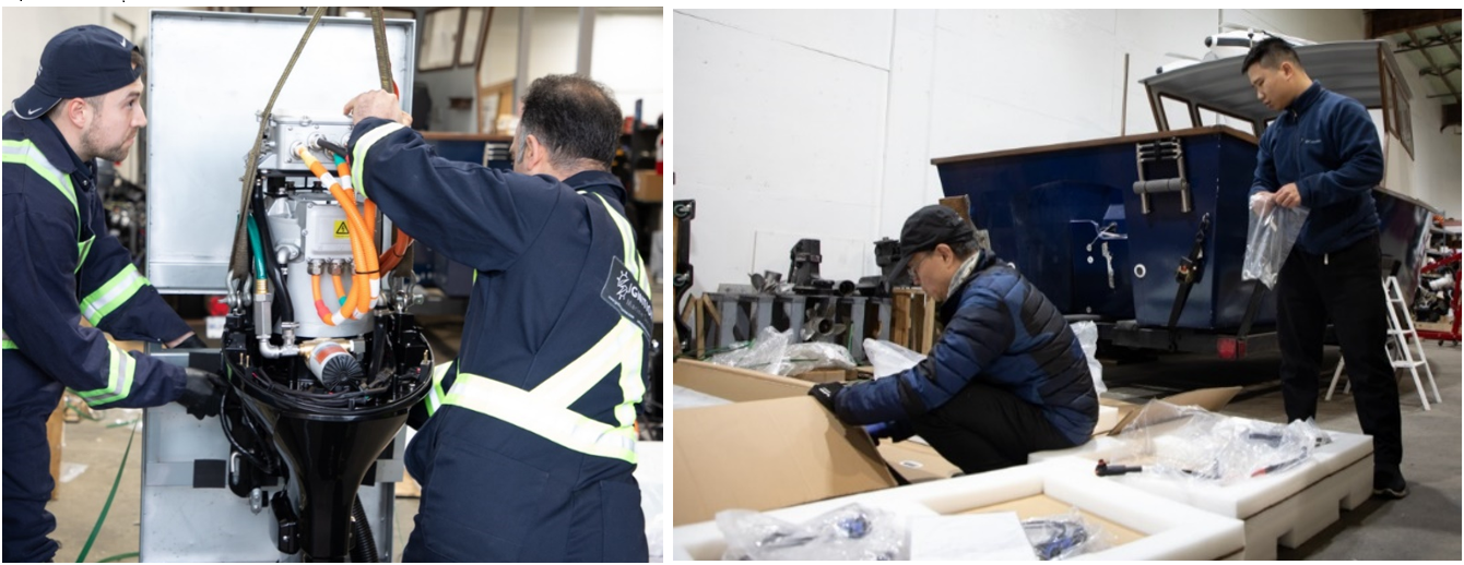 Deux personnes portant des combinaisons travaillent sur un moteur électrique pour bateau.